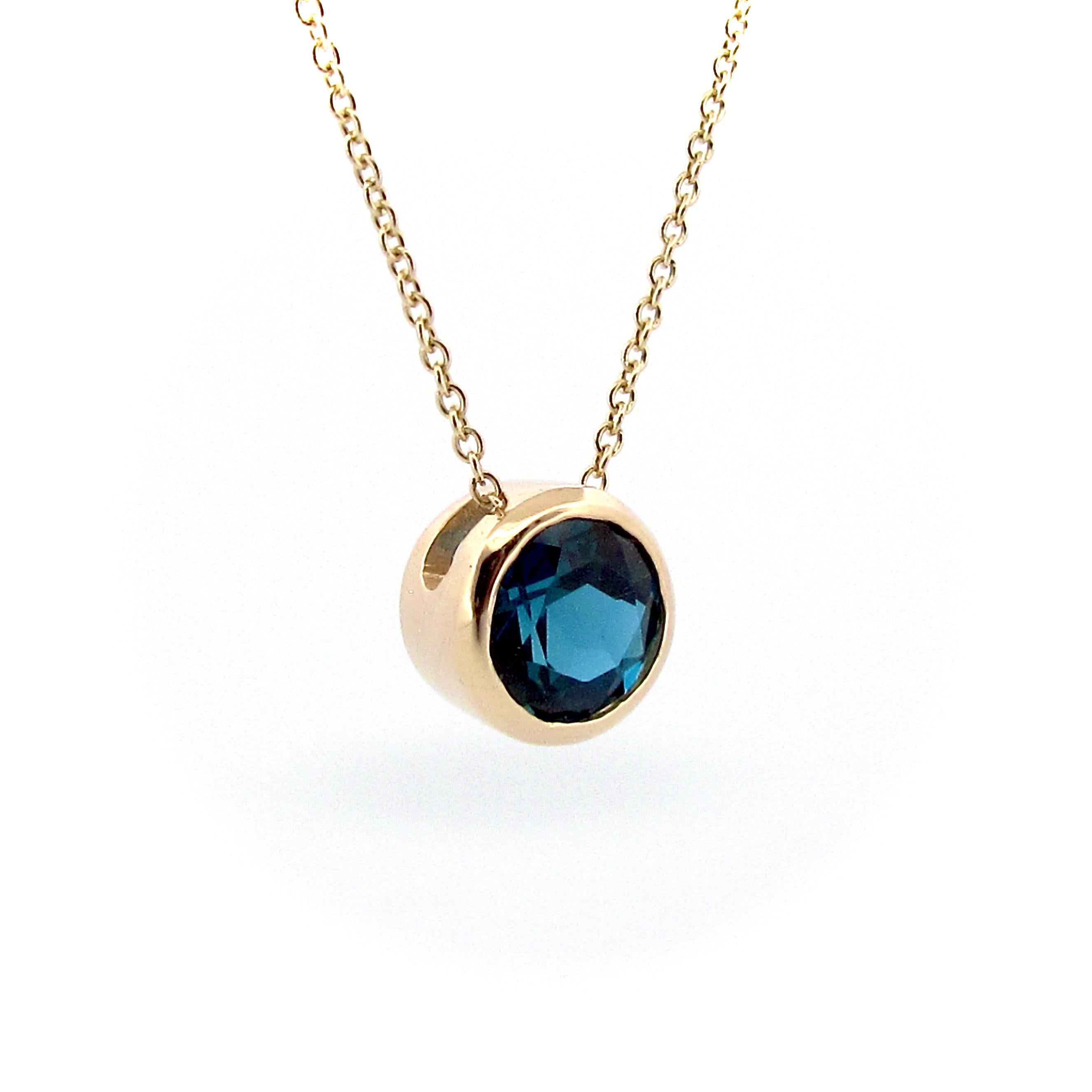 This 9ct solid Gold 7mm Round London Blue Topaz Sliding pendant is beautifully crafted, and comes on a 45cm/18inch 9ct yellow gold cable chain, it is superior in quality and has a nice weight to it. The deep blue hue of the London Blue Topaz