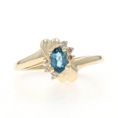 Yellow Gold London Blue Topaz Diamond Bypass Ring - 10k Oval .32ctw