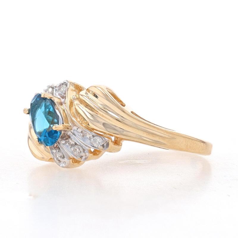 Oval Cut Yellow Gold London Blue Topaz & Diamond Bypass Ring - 14k Oval .76ctw For Sale