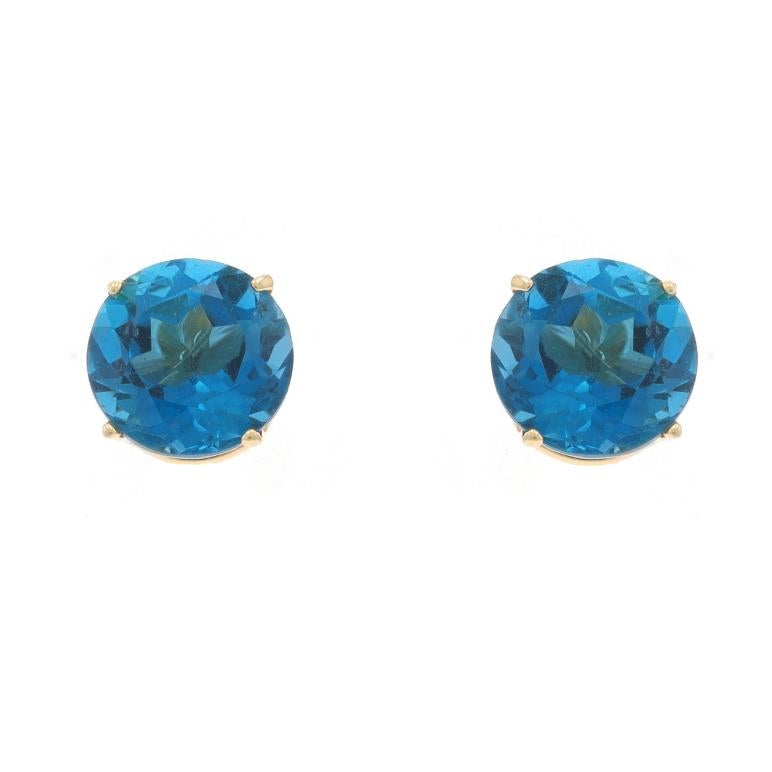 Metal Content: 14k Yellow Gold

Stone Information

Natural Topaz
Treatment: Routinely Enhanced
Carat(s): 5.00ctw
Cut: Round
Color: London Blue

Total Carats: 5.00ctw

Style: Stud
Fastening Type: Butterfly Closures

Measurements

Diameter: 11/32