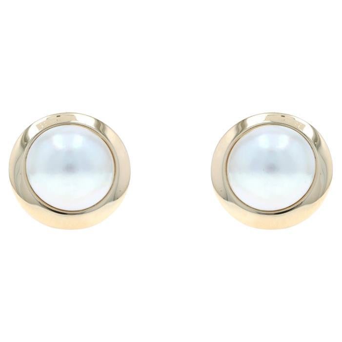 Boucles d
oreilles or jaune grandes perles Mabe - 14k percées