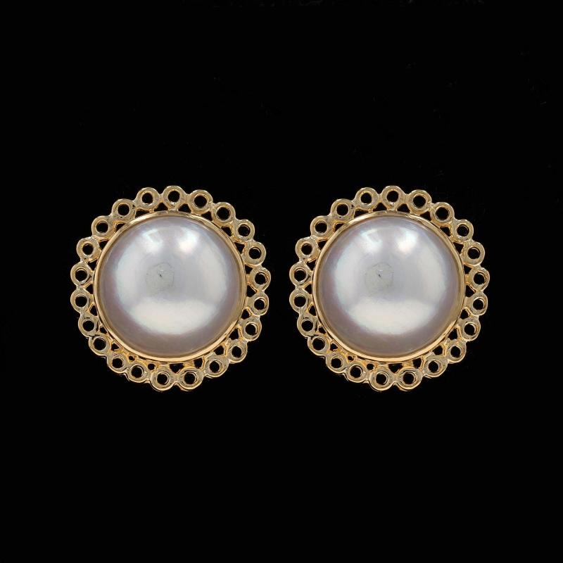 Metal Content: 14k Yellow Gold

Stone Information
Mabe Pearls
Color: White
Size: 12mm

Style: Large Stud
Fastening Type: Butterfly Closures
Features: Scallop Lace Border

Measurements
Tall: 23/32