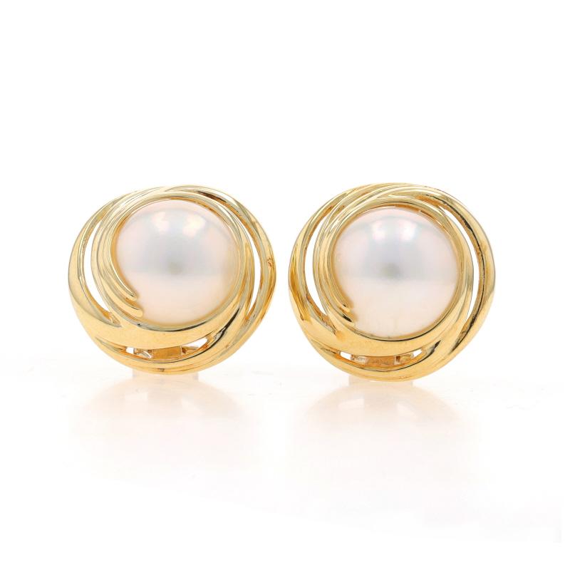 Metal Content: 14k Yellow Gold

Stone Information

Natural Mabe Pearls
Color: White

Style: Stud
Fastening Type: Non-Pierced Clip-On Closures
Theme: Swirl

Measurements

Item 1: Earrings
Tall: 13/16