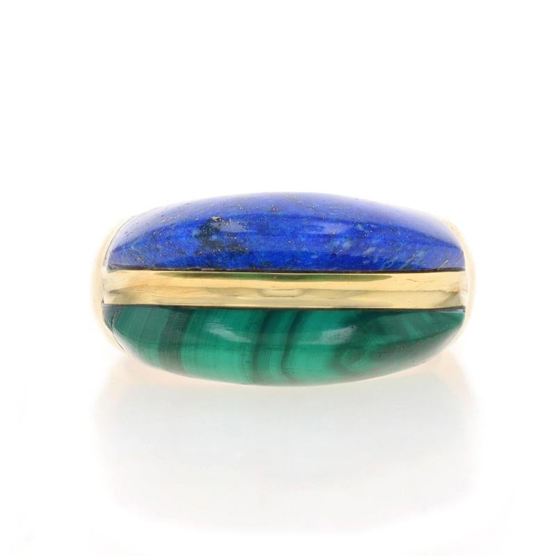 Size: 7 1/4

Metal Content: 18k Yellow Gold

Stone Information
Natural Malachite
Color: Green

Lapis Lazuli
Color: Blue

Style: Two-Stone Band
Theme: Stripe

Measurements
Face Height (north to south): 7/16