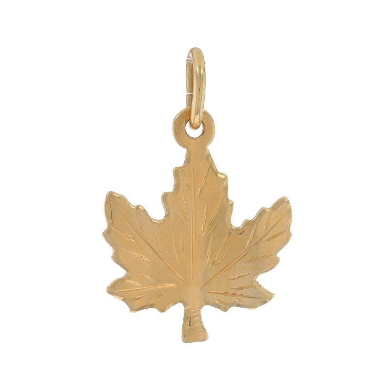 Metal Content: 14k Yellow Gold

Theme: Maple Leaf
Features: Smoothly Finished with Etched Detailing

Measurements
Tall (from stationary bail): 23/32