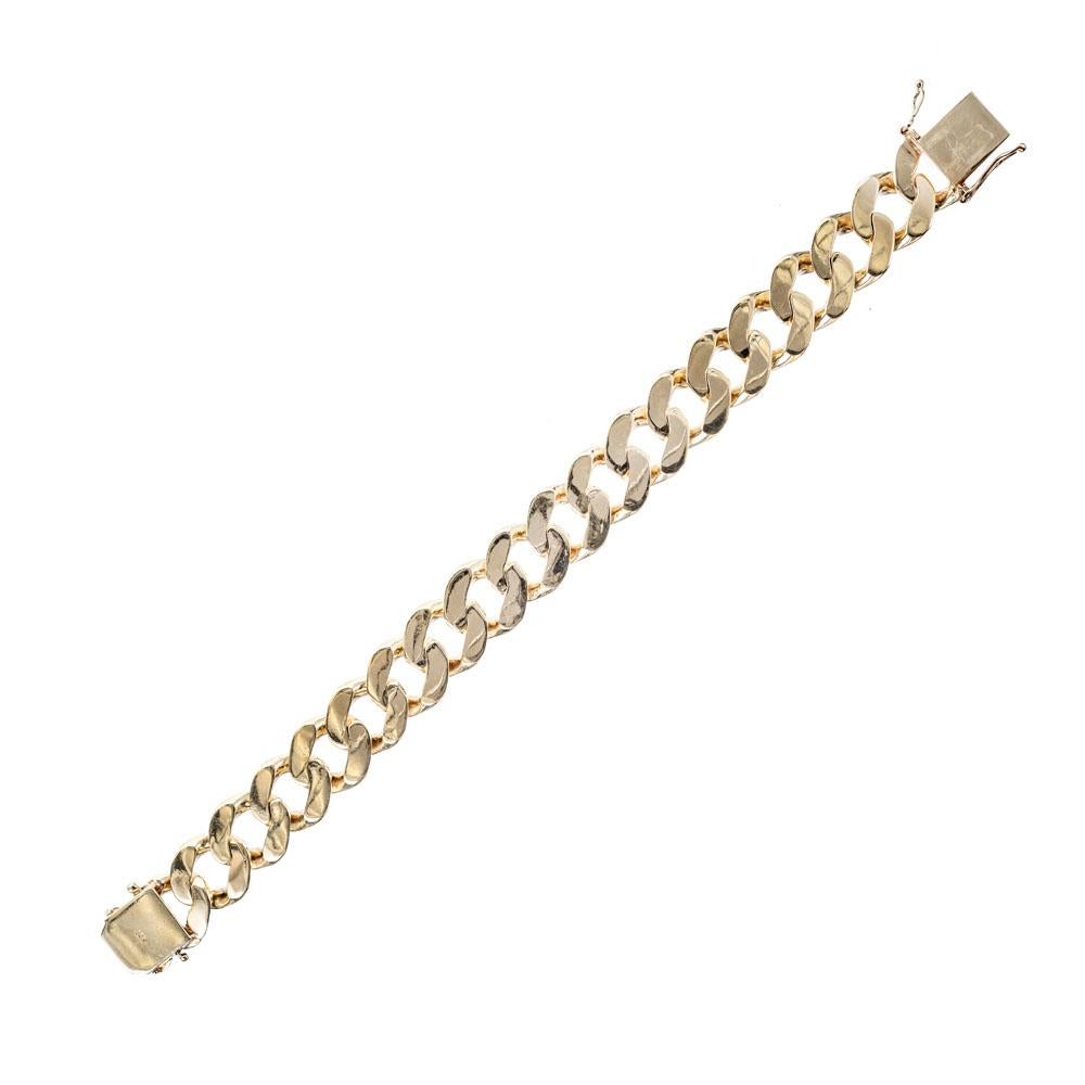 Men’s flat curb link gold bracelet. 9.5-inch-long bracelet with hidden built in catch and double side lock safety.

14k yellow gold
Tested and stamped: 14k 
100.6 grams 
Width: 17mm or .67 inch 
Depth: 4mm 
Length: 9.5 inches – Width: 16.7mm –