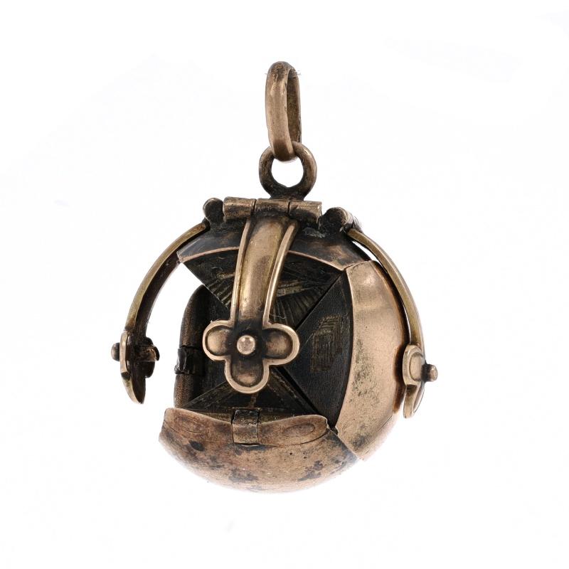 Metal Content: 9k Yellow Gold & Sterling Silver

Style: Ball Fob
Theme: Masonic Folding Orb
Features: Opens

Measurements
Tall (from stationary bail): 27/32