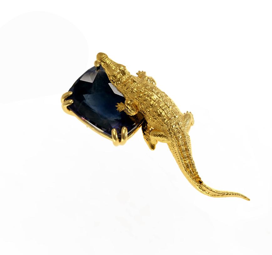 18 karat yellow gold Mesopotamian Serpent brooch is encrusted with dark blue great cut transparent sapphire, cushion or octagon cut, 4 carats. This will be a custom made piece, with 4 or 8 prongs. The gem catches eye's attention.

You can order this