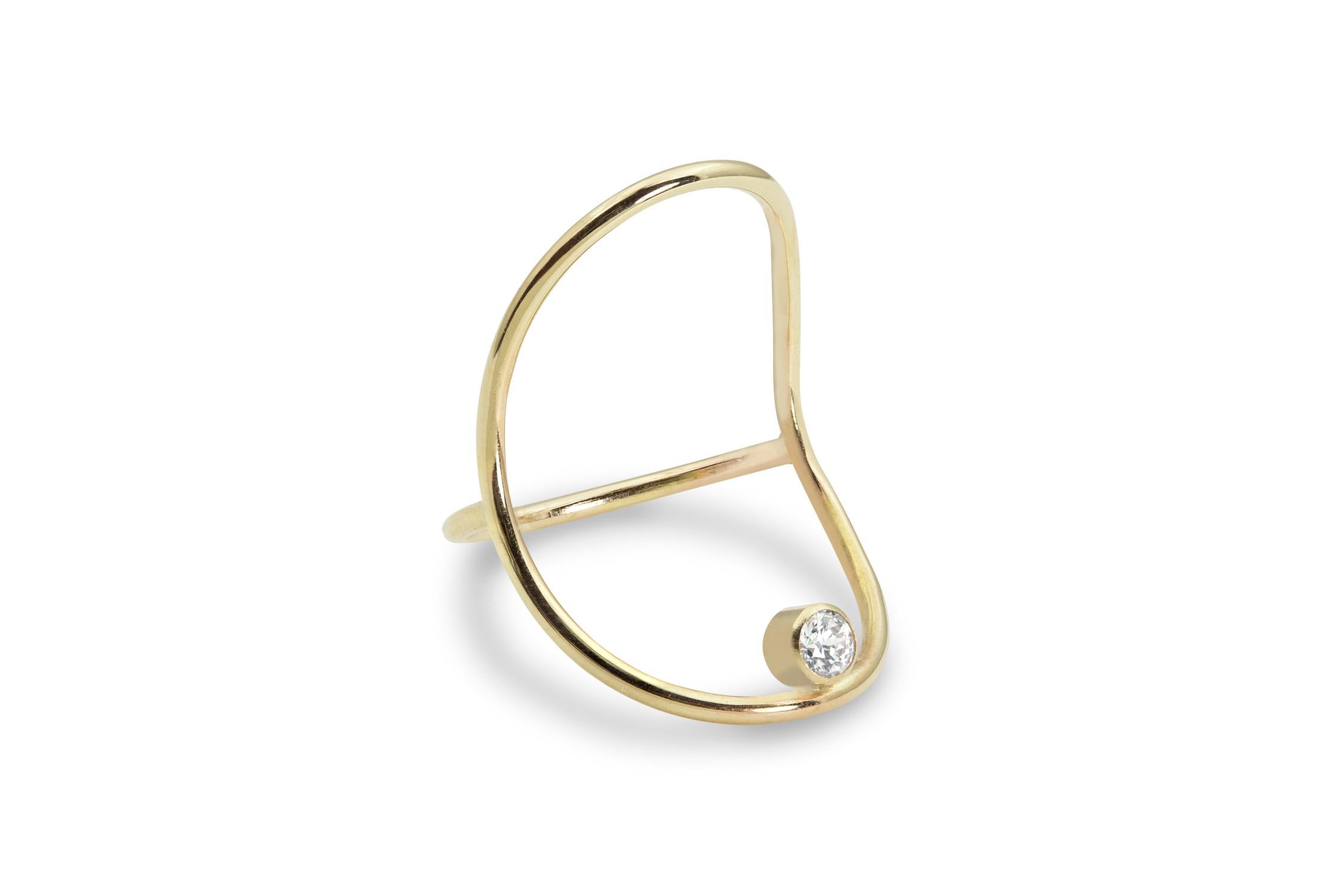 An elegant hand-formed solid 14k gold oval holds a brilliant white .10ct diamond that seems to float on the finger.  It's bold and delicate at the same time - minimal with a bit of surrealist magic, and it's streamlined design makes it very