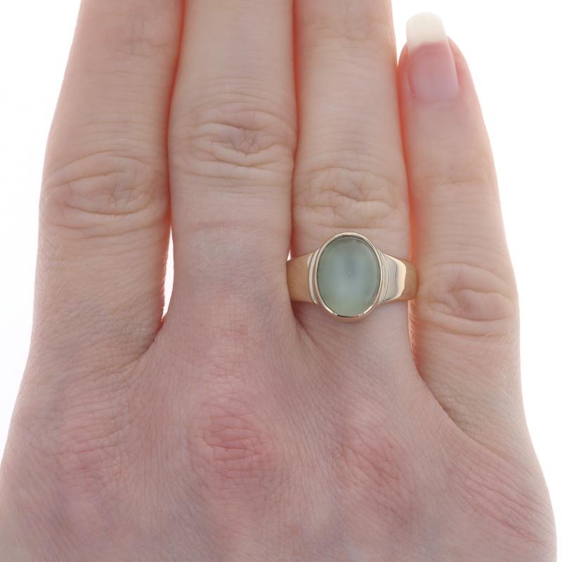 Size: 6 3/4
Sizing Fee: Up 3 sizes for $40 or Down 2 1/2 sizes for $30

Metal Content: 14k Yellow Gold

Stone Information
Natural Moonstone
Carat(s): 4.10ct
Cut: Oval Cabochon
Color: Light Yellowish Green

Total Carats: 4.10ct

Style: