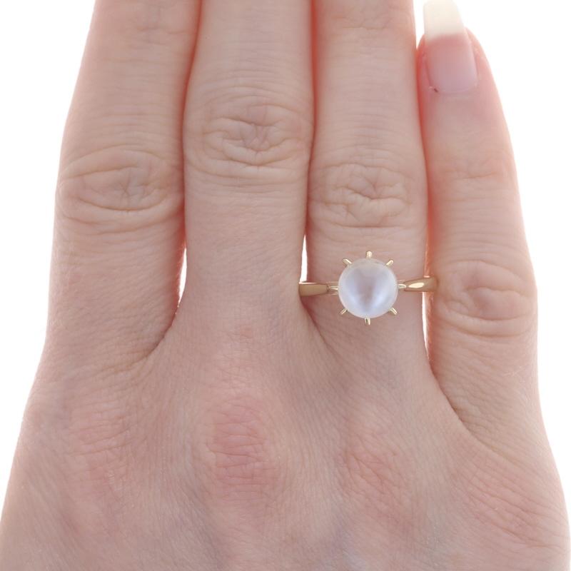 Size: 7 3/4
Sizing Fee: Up 2 sizes for $30 or Down 2 sizes for $30

Era: Vintage

Metal Content: 14k Yellow Gold

Stone Information
Natural Moonstone
Cut: Round Bead
Size: 8mm

Style: Solitaire

Measurements
Face Height (north to south): 13/32