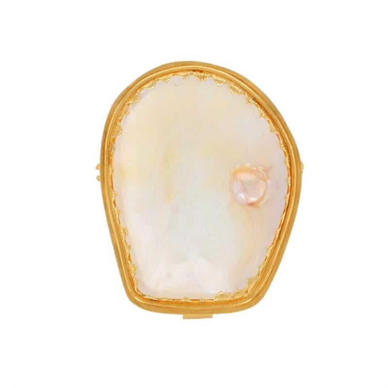 Metal Content: 18k Yellow Gold

Stone Information

Mother of Pearl with Cultured Blister Pearl

Style: Convertible Brooch/Pendant
Fastening Type: Hinged Pin and Whale Tail Bullet Clasp

Measurements

Tall: 1 7/16