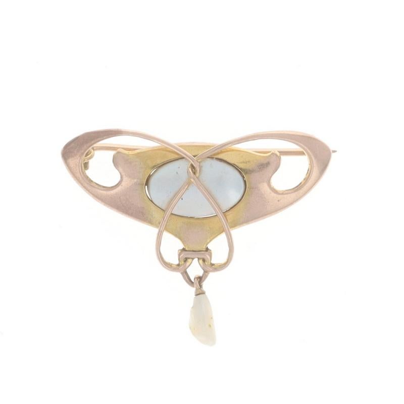 Era: Edwardian
Date: 1900s - 1910s

Metal Content: 9k Yellow Gold

Stone Information

Natural Mother of Pearl
Color: White

Natural Freshwater Pearl
Color: Cream

Style: Brooch
Fastening Type: Hinged Pin and C-Clasp

Measurements

Tall: 1 3/16