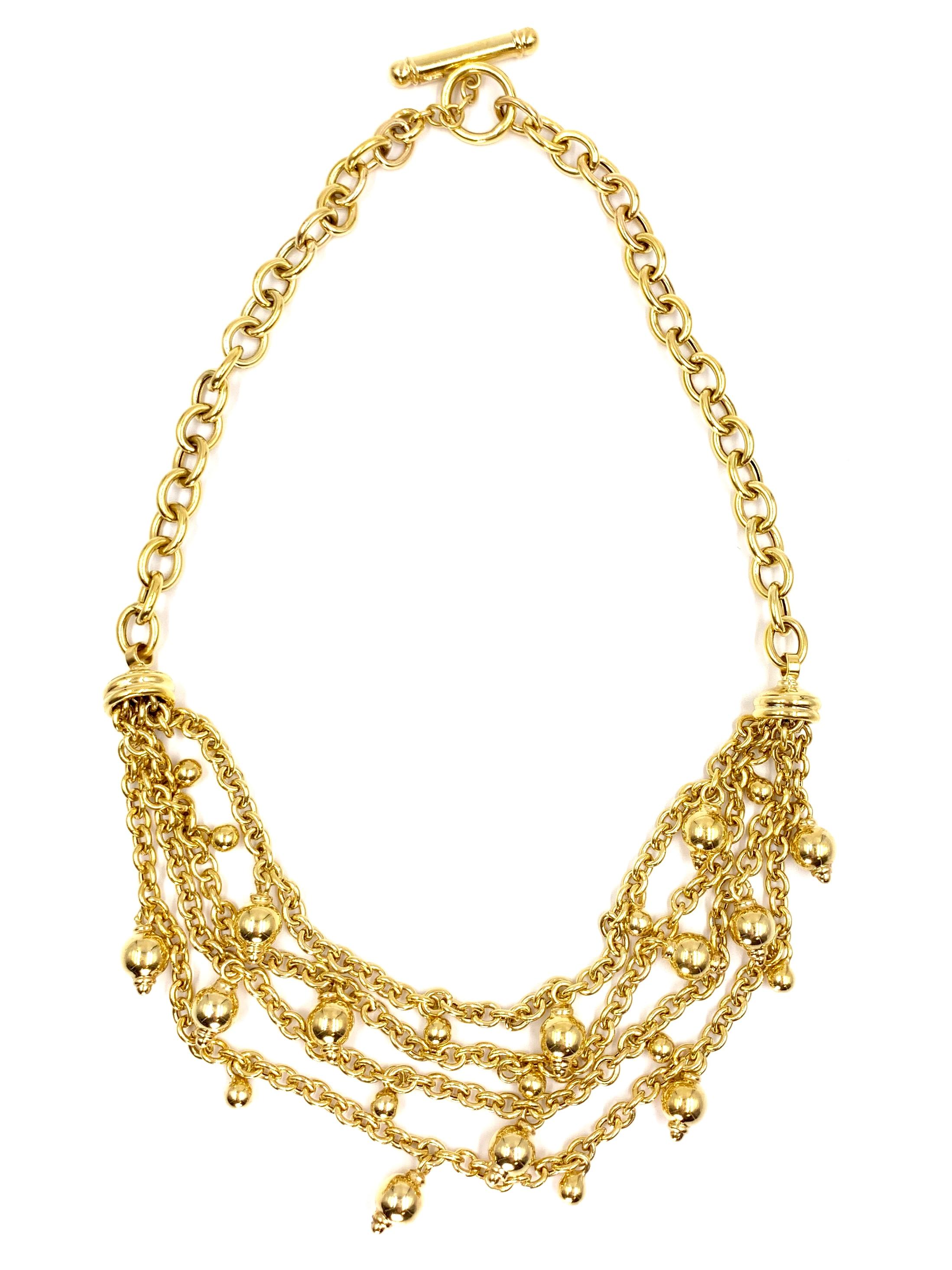 Signed JMP ITALY 14 karat yellow gold oval link necklace with a four strand bib style chain center featuring polished round dangling gold beads varying in size from 5mm to 8mm. Chains have movement and will not appear stiff while worn. Necklace