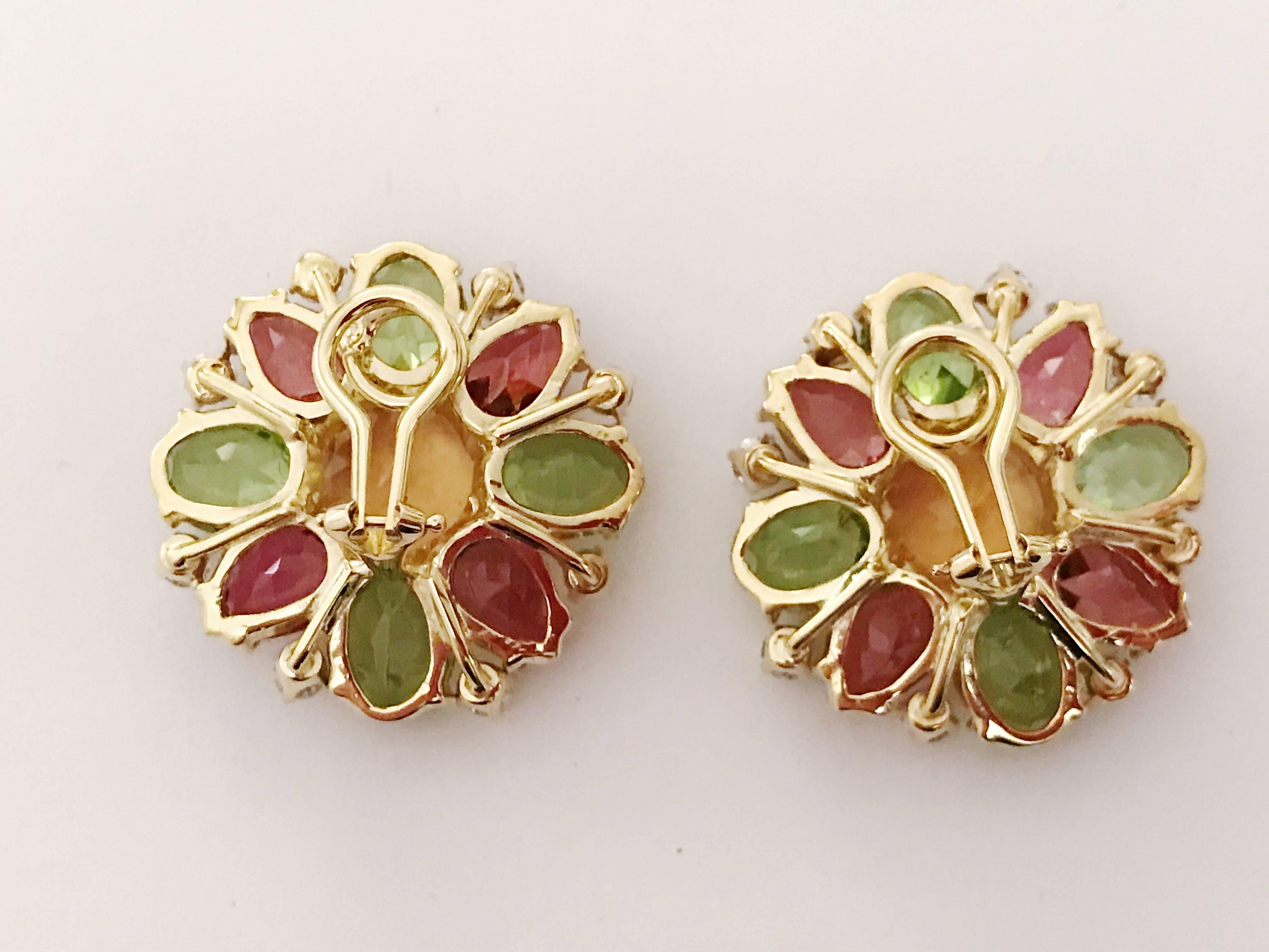 18kt Yellow Gold Flower shaped earring is a classic statement earring. The center Citrine stone is complemented with Peridot, Rubellite, and Diamonds surrounding it. The stud measure 1 inch in diameter. 

These earrings are clip-on, but posts can be