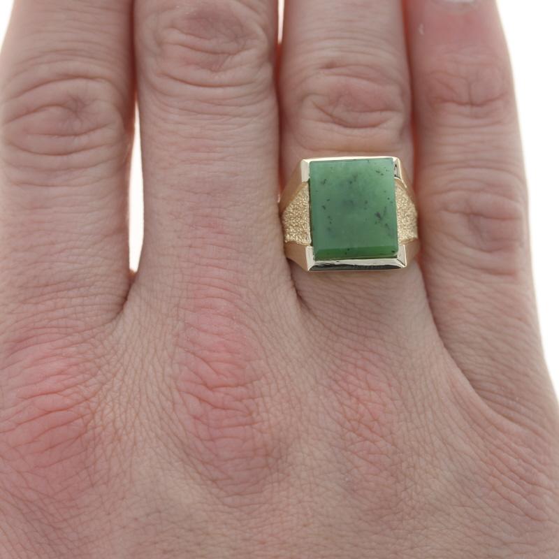 Size: 8 1/2
Sizing Fee: Down 1 for $40 or up 2 for $50

Metal Content: 14k Yellow Gold

Stone Information

Natural Nephrite Jade
Treatment: Routinely Enhanced
Cut: Rectangular Slab
Color: Green

Style:  Solitaire
Features:  Smooth & textured