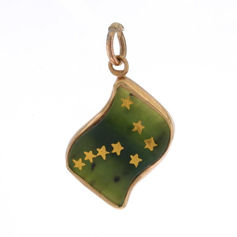 Era: Vintage

Metal Content: 10k Yellow Gold

Stone Information
Natural Nephrite Jade
Treatment: Routinely Enhanced
Color: Green

Theme: Alaska State Flag, Travel

Measurements
Tall (from stationary bail): 15/16