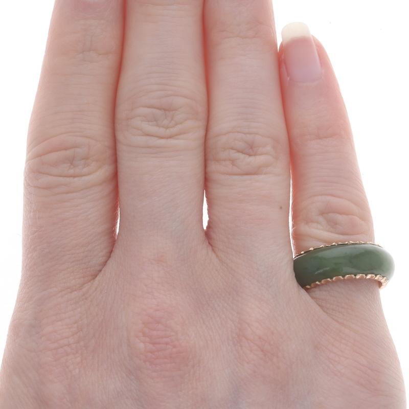 Size: 4 1/4

Era: Vintage

Metal Content: 14k Yellow Gold

Stone Information

Natural Nephrite Jade
Treatment: Routinely Enhanced
Color: Green

Style: Eternity Band
Features: Scallop Edge Detailing

Measurements

Face Height (north to south): 5/16