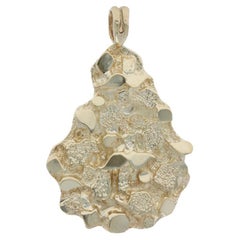 Ciondolo con pepita in oro giallo 14k