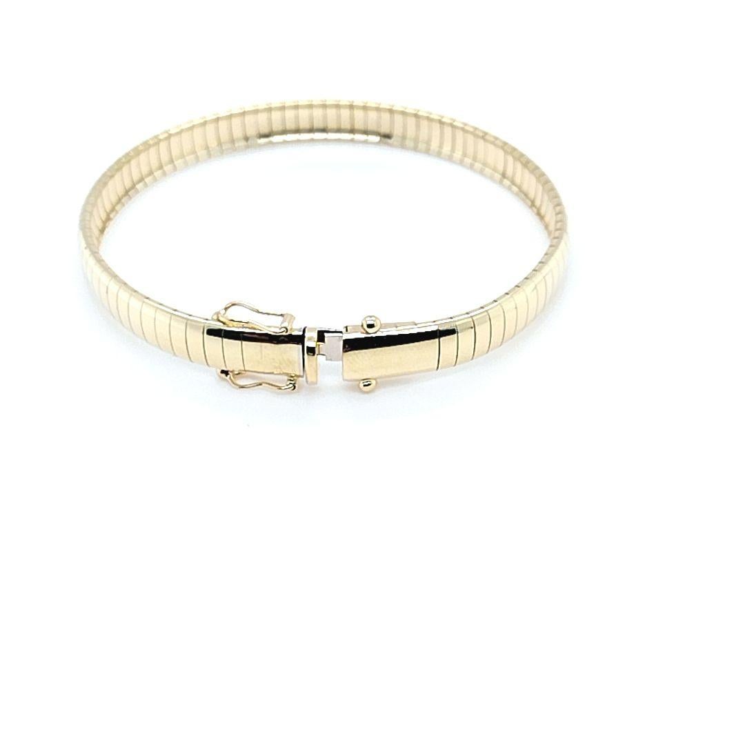 Bracelet chaîne Omega en or jaune Pour femmes en vente