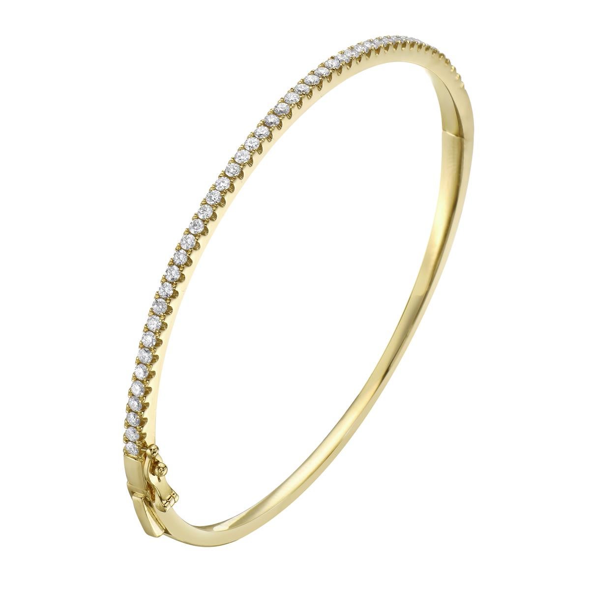 Fashion and glam are at the forefront with this exquisite diamond bangle. This 14-karat yellow gold bangle is made from 10.3 grams of gold. The top is adorned with one row of SI1-0SI2, GH color diamonds made out of 45 round diamonds totaling 0.92
