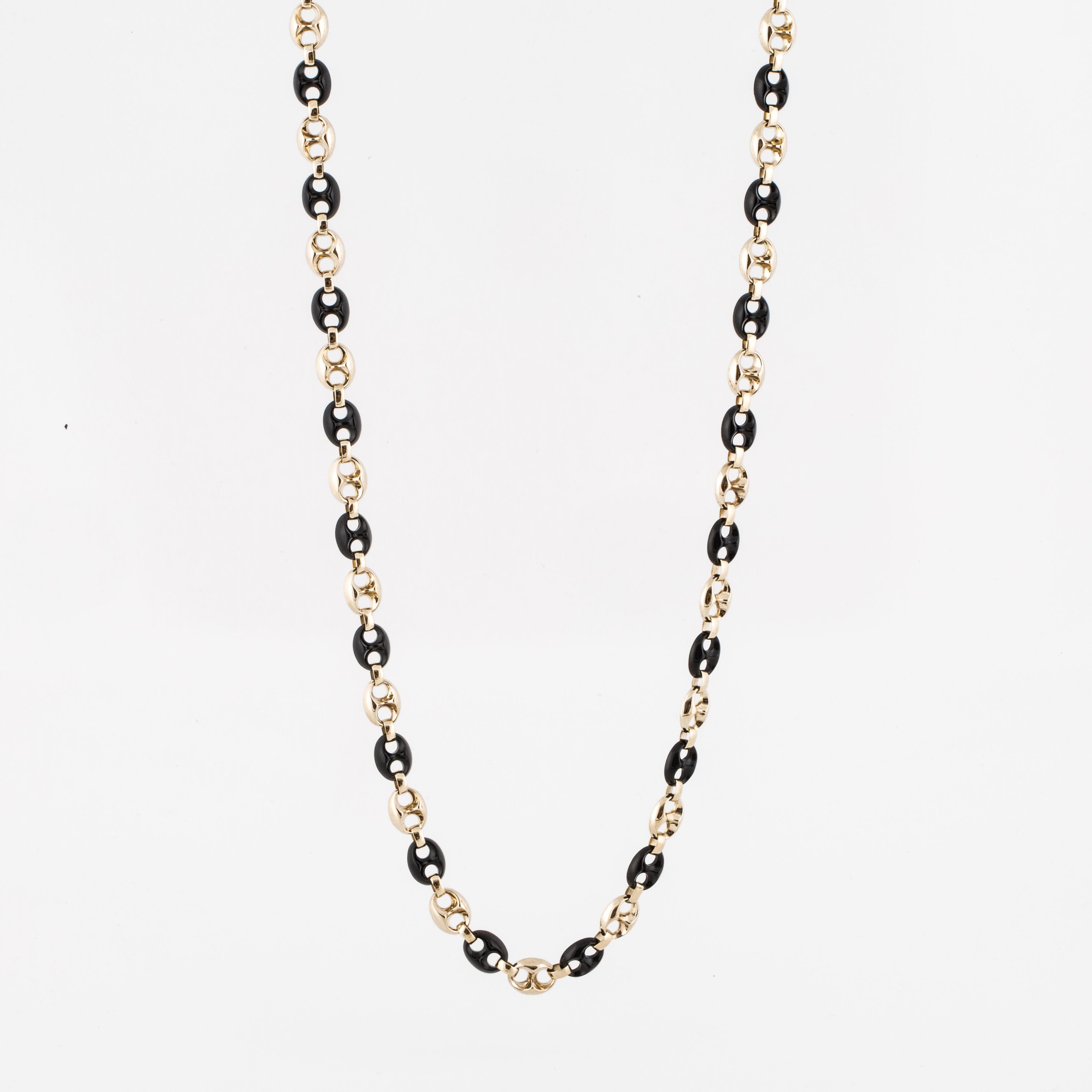 14K yellow gold and onyx necklace with alternating gold and onyx anchor links.  Tongue closure with figure eight safety.  Measures 3/8 inches wide and 30 inches long.