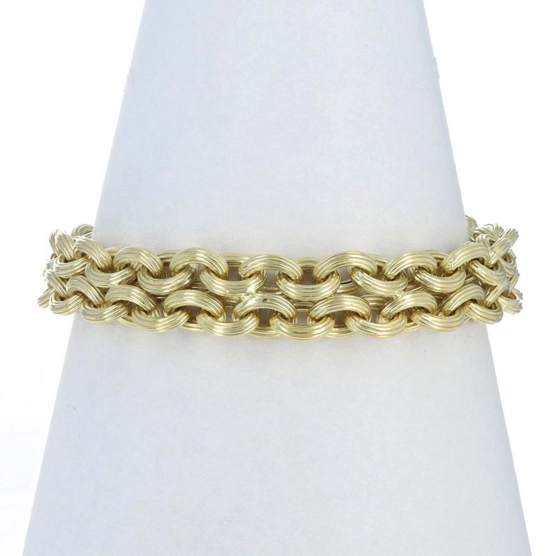 Metal Content: 14k Yellow Gold

Stone Information

Natural Onyx
Cut: Round Cabochon

Chain Style: Cable
Bracelet Style: Chain
Fastening Type: Toggle Clasp
Features: Grooved Links, Shiny & Matte Finishes

Measurements

Chain Width: 15/32