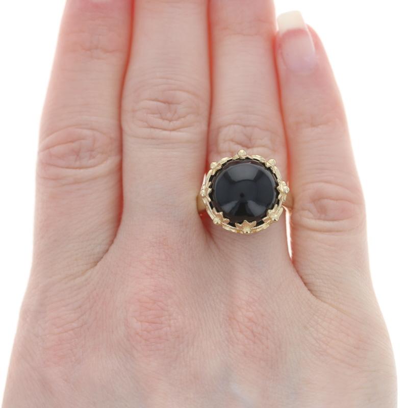 Size: 7 1/4
Sizing Fee: Down 2 sizes for $30 or up 2 sizes for $35

Metal Content: 14k Yellow Gold

Stone Information
Natural Onyx
Cut: Round Cabochon
Color: Black

Style: Cocktail Solitaire 
Theme: Leaf Spiral

Measurements
Face Height (north to