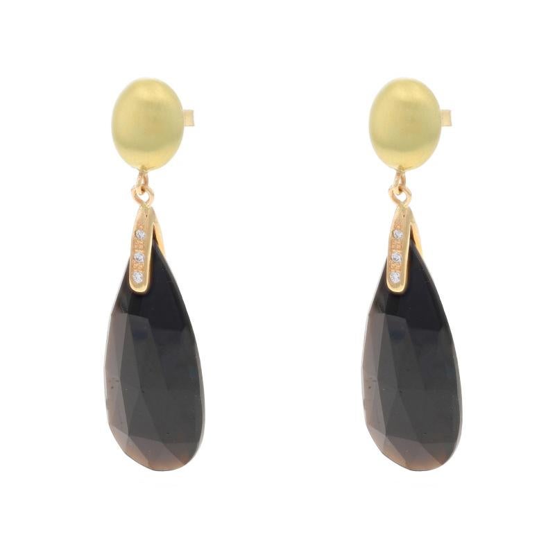 Metal Content: 14k Yellow Gold & 14k Green Gold

Stone Information
Natural Onyx
Cut: Pear Double Cabochon
Color: Black

Natural Diamonds
Carat(s): .05ctw
Cut: Round Brilliant
Color: F - G
Clarity: VS1 - VS2

Style: Dangle
Fastening Type: Butterfly