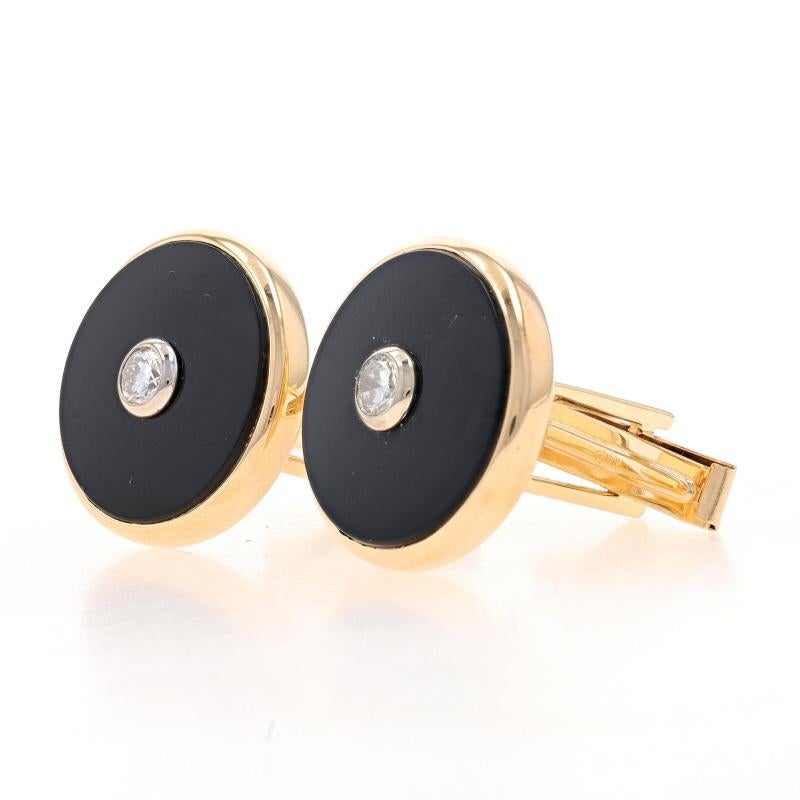 Metal Content: 14k Yellow Gold & 14k White Gold

Stone Information
Natural Onyx
Color: Black

Natural Diamonds
Carat(s): .36ctw
Cut: Round Brilliant
Color: H - I
Clarity: VS1 - VS2

Total Carats: .36ctw

Style: Cufflinks
Theme: Geometric