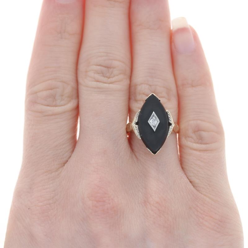 Size: 6 1/2
Sizing Fee: Down 1 for $30 or up 2 for $35

Era: Vintage

Metal Content: 10k Yellow Gold & 10k White Gold

Stone Information

Natural Onyx
Color: Black

Natural Diamond
Carat(s): .08ct
Cut: European
Color: H
Clarity: SI2

Style: 