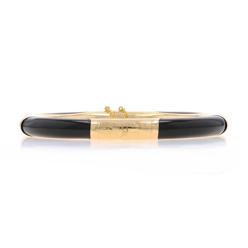 Metal Content: 14k Yellow Gold

Stone Information

Natural Onyx
Color: Black

Style: Bangle
Fastening Type: Tab Box Clasp with Safety Chain
Theme: Floral, Botanical
Features: Etched Detailing

Measurements

Inner Circumference: 7