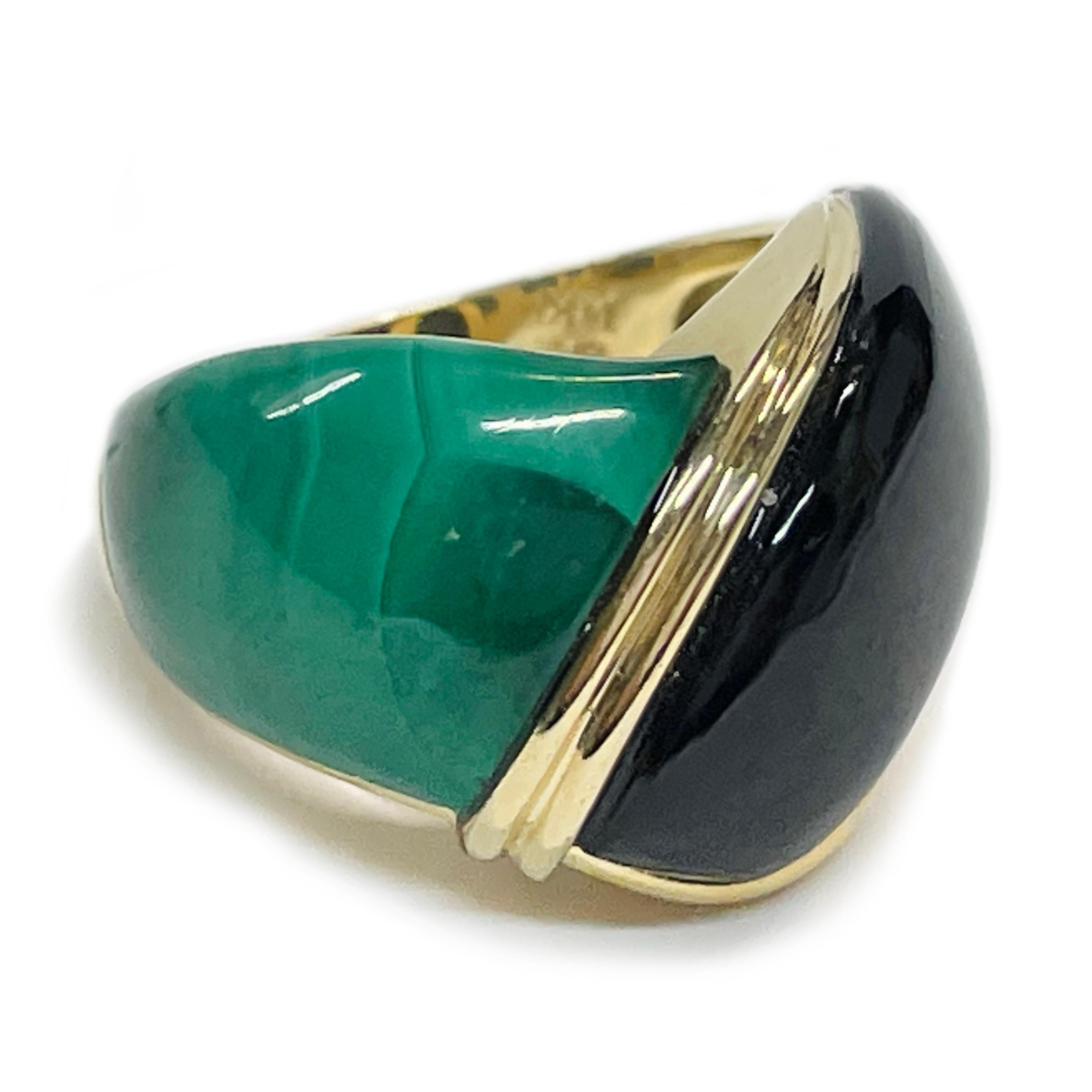 14 Karat Black Onyx Malachite Cabochon Ring. The ring features an inlay black onyx and malachite special-cut cabochons set in between a gold frame. The ring has a smooth shiny finish and a tapered band. The ring size is 6 1/2. Stamped on the inside