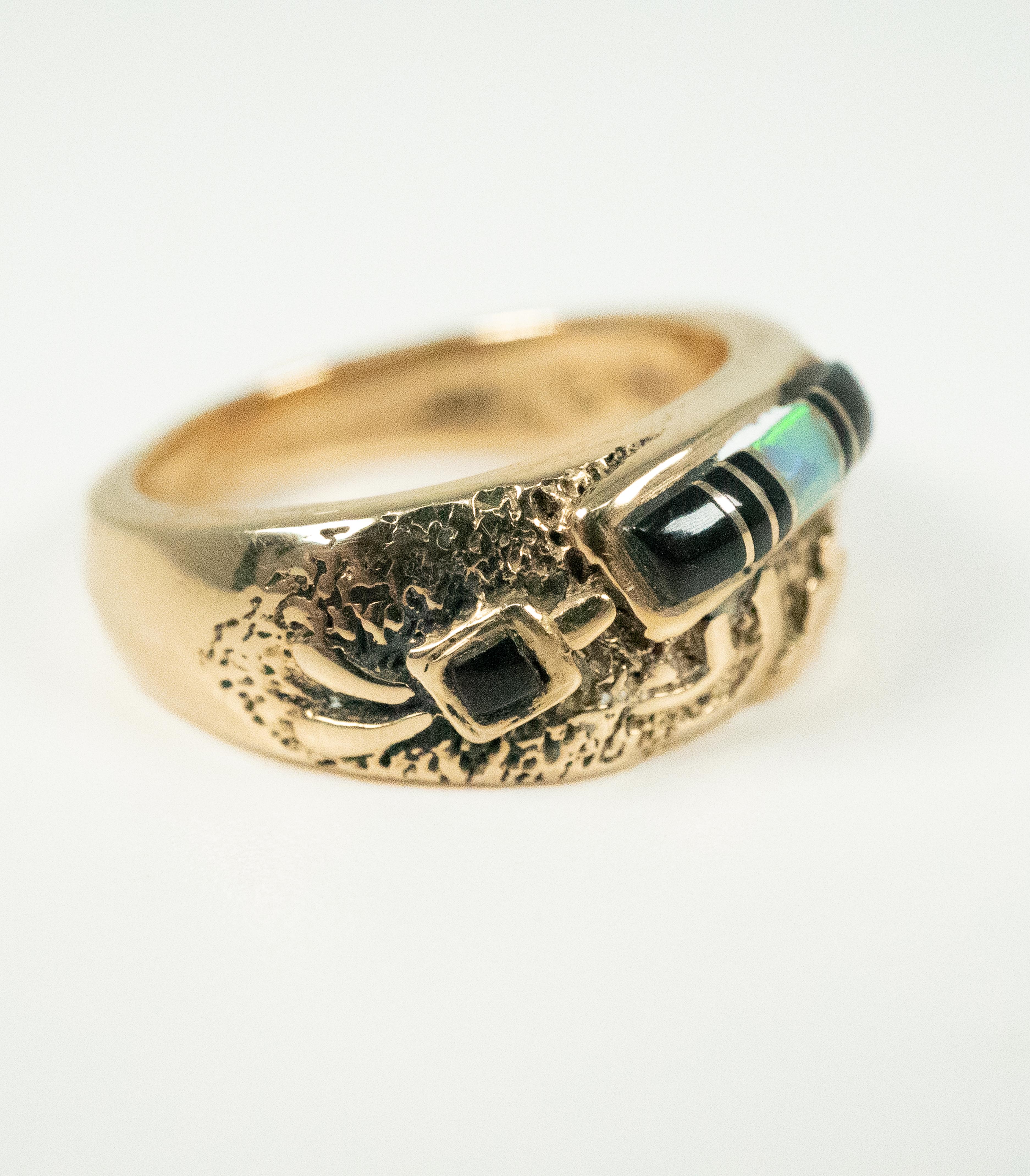 A very unusual ring, with a beautiful inlay of black onyx and opal!