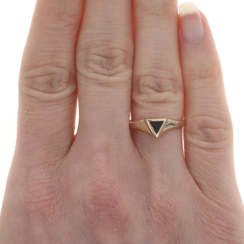 Size: 7
Sizing Fee: Up 2 sizes for $35 or Down 1 size for $35

Metal Content: 14k Yellow Gold

Stone Information
Natural Onyx
Color: Black

Style: Solitaire
Theme: Triangle, Geometric

Measurements
Face Height (north to south): 1/4