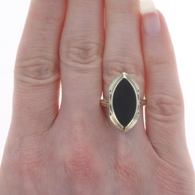 Size: 6 1/4
Sizing Fee: Up 1 size for $35 or Down 1 size for $35

Era: Vintage

Metal Content: 14k Yellow Gold

Stone Information
Natural Onyx
Color: Black

Style: Cocktail Solitaire
Features: Etched Detailing

Measurements
Face Height (north to