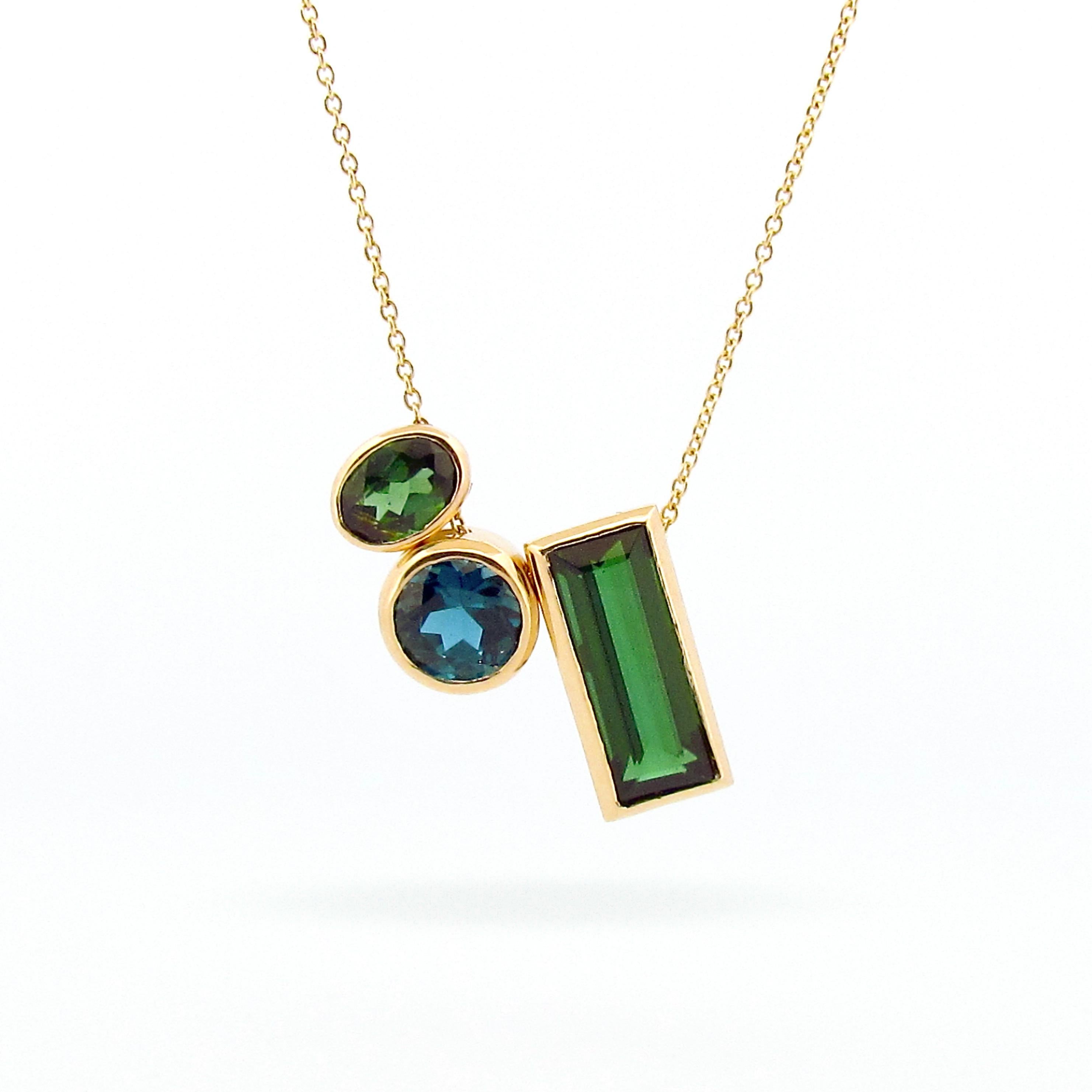 This 9ct solid Gold Sliding pendant is set with a beautiful 3.35ct deep Green step cut  Baguette Tourmaline, this is a one of a kind necklace, The deep green hues and beautiful cut captures the eye, making this piece a fun statement piece to wear on