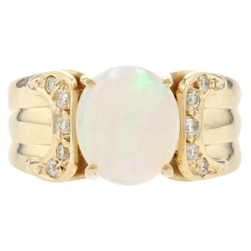 Yellow Gold Opal and Diamond Ring, 18 Karat Oval Cabochon Cut 1.75 Carat Ribbed For Sale