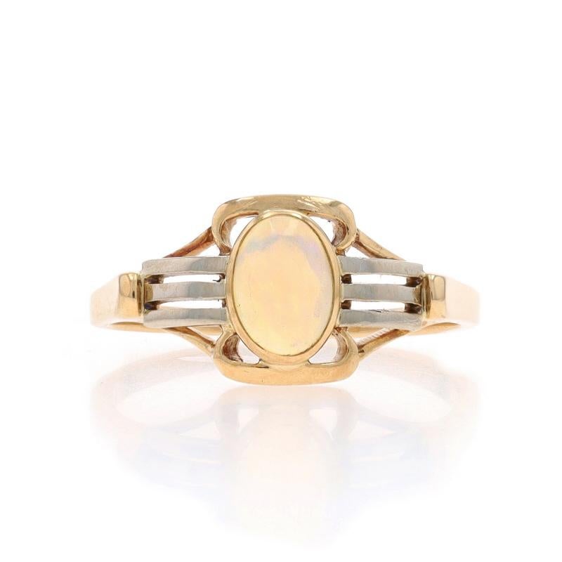 Size: 7
Sizing Fee: Up 2 sizes for $35 or Down 1 size for $35

Era: Art Deco
Date: 1920s - 1930s

Metal Content: 14k Yellow Gold & 14k White Gold

Stone Information

Natural Opal
Carat(s): .34ct
Cut: Oval Cabochon

Total Carats: .34ct

Style: