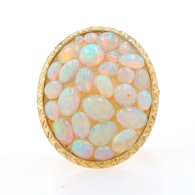 Size: 5 1/4

Metal Content: 18k Yellow Gold

Stone Information
Natural Opals
Carat(s): 7.20ctw
Cut: Oval Cabochon & Round Cabochon
Stone Note: Ethiopian

Total Carats: 7.20ctw

Style: Cluster Cocktail
Features: Etched Detailing

Measurements
ace