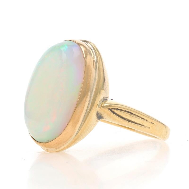 Size: 8
Sizing Fee: Up 2 sizes for $40 or Down 2 sizes for $40

Metal Content: 14k Yellow Gold

Stone Information

Natural Opal
Carat(s): 6.30ct
Cut: Oval Cabochon

Total Carats: 6.30ct

Style: Cocktail Solitaire
Features: Etched Shoulder