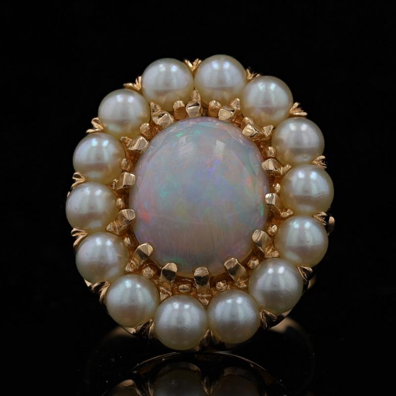 Size: 6 1/4
Sizing Fee: Up 2 sizes for $35 or Down 2 sizes for $30

Era: Vintage

Metal Content: 14k Yellow Gold

Stone Information

Natural Opal
Carat(s): 2.60ct
Cut: Oval Cabochon
Stone Note: Australian

Cultured Pearls

Total Carats: