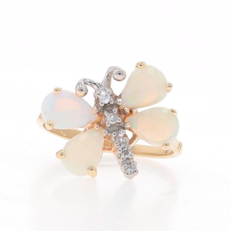 Size: 6 1/2
Sizing Fee: Up 2 1/2 sizes for $35 or Down 1 1/2 sizes for $35

Metal Content: 14k Yellow Gold & 14k White Gold

Stone Information

Natural Opals
Carat(s): 1.15ctw
Cut: Pear Cabochon

Natural Diamonds
Carat(s): .03ctw
Cut: Single
Color: