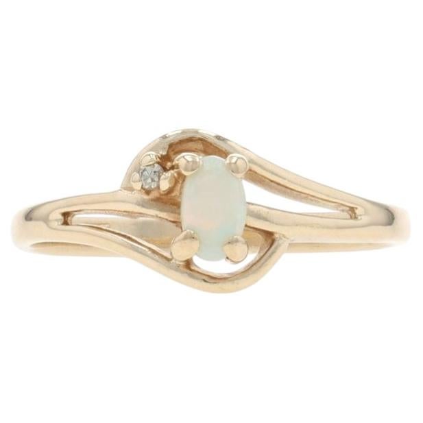 Yellow Gold Opal Diamond Bypass Ring - 10k Oval Cabochon .13ctw For Sale