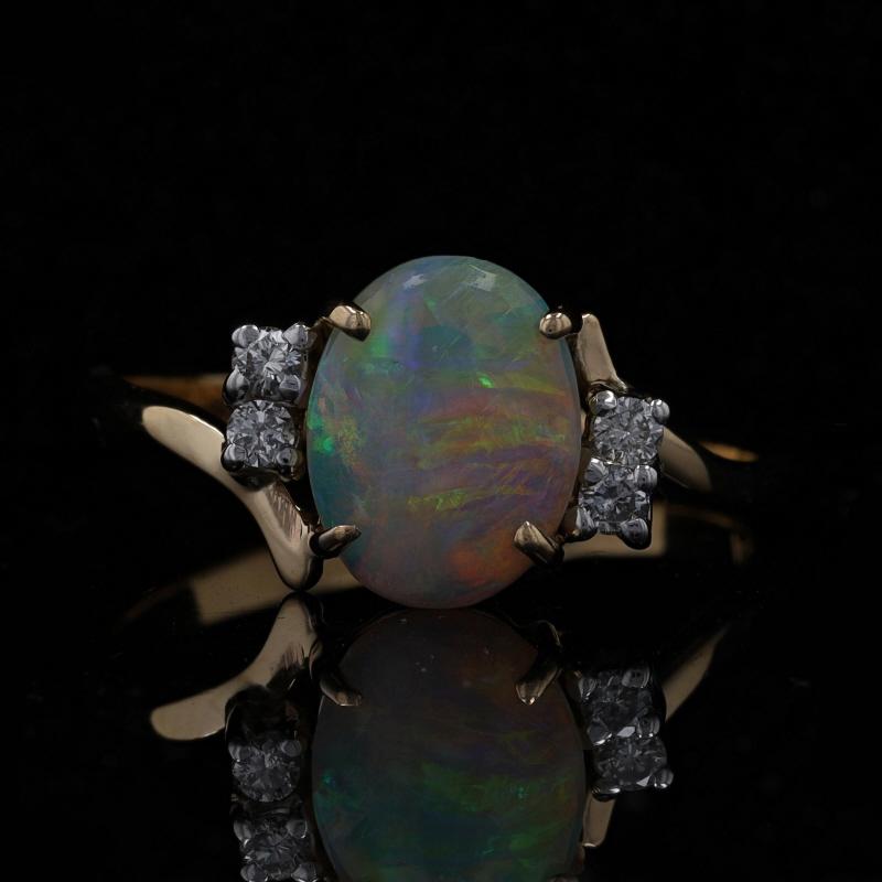 Size: 8 1/2
Sizing Fee: Up 2 sizes for $35 or Down 3 sizes for $30

Metal Content: 14k Yellow Gold & 14k White Gold

Stone Information

Natural Opal
Carat(s): 1.30ct
Cut: Oval Cabochon
Stone Note: Australian origin with great play of color

Natural