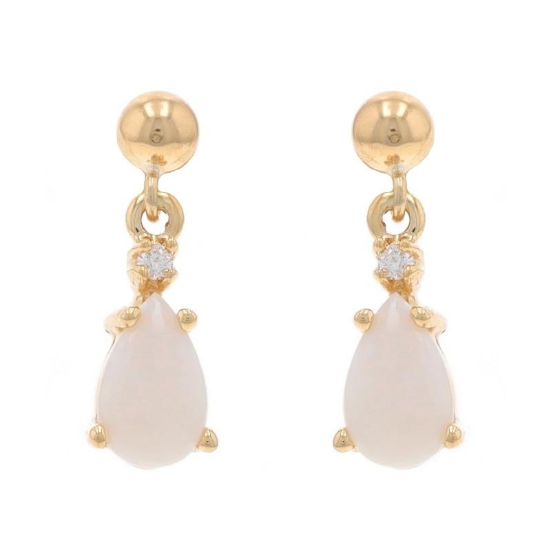 Metal Content: 14k Yellow Gold

Stone Information

Natural Opals
Carat(s): .80ctw
Cut: Pear Cabochon

Natural Diamonds
Carat(s): .02ctw
Cut: Round Brilliant
Color: G - H
Clarity: VS1 - VS2

Total Carats: .82ctw

Style: Dangle
Fastening Type: