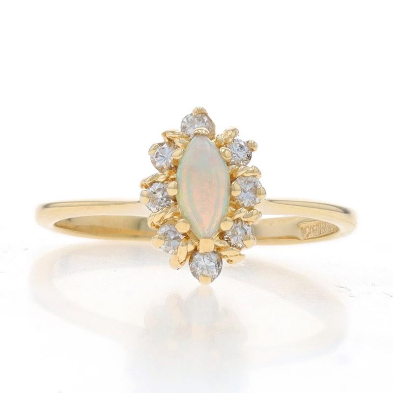 Size: 5 3/4
Sizing Fee: Up 2 sizes for $35 or Down 2 sizes for $35

Metal Content: 14k Yellow Gold

Stone Information

Natural Opal
Carat(s): .13ct
Cut: Marquise Cabochon

Natural Diamonds
Carat(s): .20ctw
Cut: Round Brilliant
Color: G - H
Clarity: