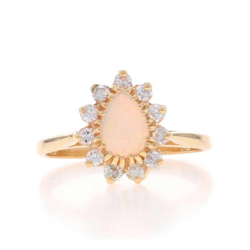Size: 5
Sizing Fee: Up 3 sizes for $35 or Down 1 1/2 sizes for $35

Metal Content: 14k Yellow Gold

Stone Information

Natural Opal
Carat(s): .25ct
Cut: Pear Cabochon

Natural Diamonds
Carat(s): .25ctw
Cut: Round Brilliant
Color: G - H
Clarity: SI2