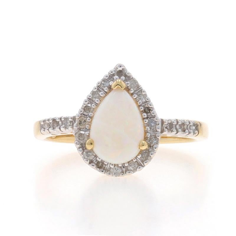 Metal Content: 14k Yellow Gold & 14k White Gold

Stone Information

Natural Opal
Carat(s): .58ct
Cut: Pear Cabochon

Natural Diamonds
Carat(s): .20ctw
Cut: Single
Color: G - H
Clarity: I2 - I3

Total Carats: .78ctw

Style: Solitaire with Accents
