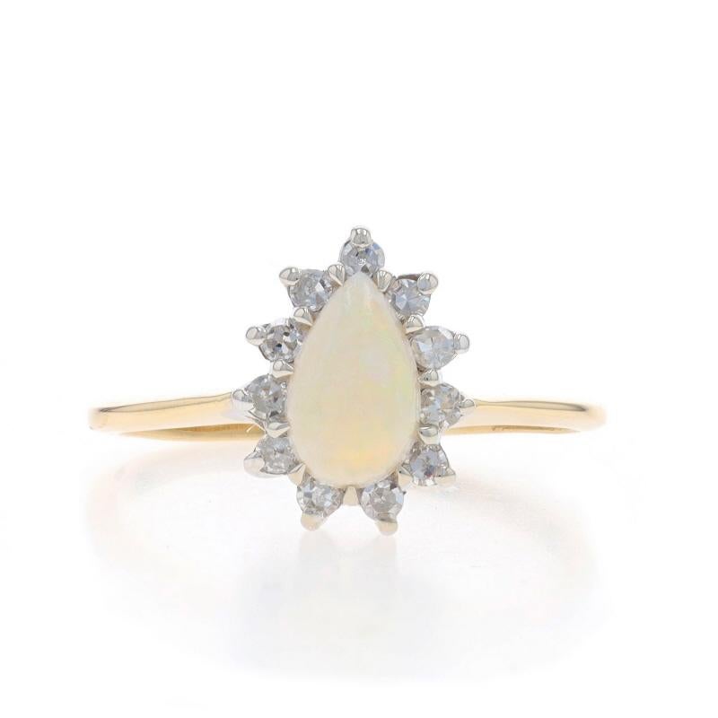 Size: 8 1/2
Sizing Fee: Up 3 sizes for $35 or Down 3 1/2 sizes for $25

Metal Content: 14k Yellow Gold & 14k White Gold

Stone Information
Natural Opal
Carat(s): .63ct
Cut: Pear Cabochon

Natural Diamonds
Carat(s): .20ctw
Cut: Single
Color: F -
